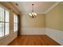 Spacious dining room features hardwood floors, crown molding, and ample natural light at 1668 Sabastian Ne Pt, Atlanta, GA 30329