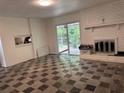 A bright living room with a fireplace and access to the backyard at 2969 Favor Sw Rd, Marietta, GA 30060