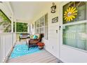 Inviting front porch with comfortable seating, seasonal decorations, and a relaxing outdoor space at 394 Thornbrooke Dr, Hiram, GA 30141