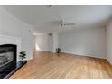 Spacious living room featuring hardwood floors, fireplace, and neutral paint at 525 Hunnicutt Se Rd, Mableton, GA 30126