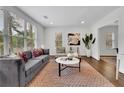 Elegant living room bathed in natural light with plush seating, modern decor, and a cozy area rug at 2222 Beecher Sw Cir, Atlanta, GA 30311