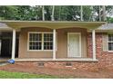 Close-up of the home's brick-and-siding front porch with an ADT security system visible at 2543 Asbury Court Ct, Decatur, GA 30033