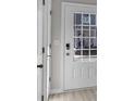 Bright entryway featuring a white door with glass panes, light-colored flooring, and neutral wall paint at 2766 Aralynn Way, College Park, GA 30337