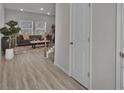 Spacious foyer with wood-look floors, neutral walls, and a view of the living area and staircase at 2766 Aralynn Way, College Park, GA 30337