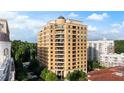 Luxury high-rise condominium building showcasing elegant architecture, multiple balconies, and a tree-lined street at 3286 Northside Nw Pkwy # Ph2, Atlanta, GA 30327