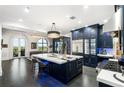 Gourmet kitchen with a large island, stainless steel appliances, and elegant lighting at 3286 Northside Nw Pkwy # Ph2, Atlanta, GA 30327