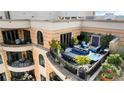 Stunning rooftop terrace boasting a hot tub, comfortable seating, lush greenery and city views at 3286 Northside Nw Pkwy # Ph2, Atlanta, GA 30327