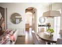 Bright and airy living room with hardwood floors, modern decor, and view into the kitchen at 4222 Rickenbacker Ne Dr # 9, Atlanta, GA 30342