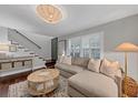Open-concept living area featuring a staircase and comfortable seating at 2 Arpege Nw Way, Atlanta, GA 30327