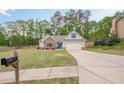 Inviting single-Gathering home with a two-car garage, blue trim, and a spacious front yard at 549 Greenridge Ln, Loganville, GA 30052