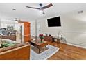 Bright and airy living room features hardwood floors, TV, and modern finishes at 1438 Heritage Glen Dr, Marietta, GA 30068
