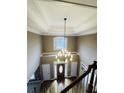 Grand foyer with high ceilings, a chandelier, and elegant staircase at 2640 Preston Ridge Ln, Dacula, GA 30019