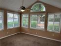 Bright sunroom with neutral walls, carpet flooring and multiple windows providing ample natural light at 2191 Rockbridge Road # 2603, Stone Mountain, GA 30087