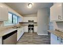 Modern kitchen with stainless steel appliances, granite countertops, and ample cabinet space at 2478 Wood Meadows Sw Dr, Marietta, GA 30064
