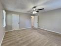 Large main bedroom featuring a ceiling fan, carpet floors, and natural light at 2478 Wood Meadows Sw Dr, Marietta, GA 30064