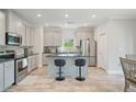 Bright kitchen features stainless steel appliances, stylish island, and ample cabinet space at 31 Thunderhawk Ne Ln, Rydal, GA 30171