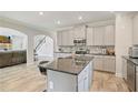 Modern kitchen with stainless steel appliances, sleek countertops, island and open layout at 31 Thunderhawk Ne Ln, Rydal, GA 30171
