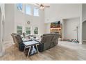 Inviting living room with a vaulted ceiling, fireplace, and large windows for natural light at 31 Thunderhawk Ne Ln, Rydal, GA 30171