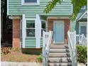 Inviting front entrance with brick details and a clean, white-framed doorway at 5037 Laurel Springs Se Way, Smyrna, GA 30082