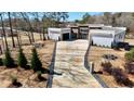Beautiful modern home with a long driveway, professional landscaping and unique architectural features at 292 Highway 279, Fayetteville, GA 30214