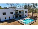 Beautiful home with a stunning pool, glass-railed balcony, and plenty of outdoor space at 292 Highway 279, Fayetteville, GA 30214