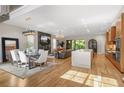 Spacious open floorplan with dining, living, and kitchen areas featuring hardwood floors at 1380 Wayne Ne Ave, Atlanta, GA 30306