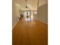 Bright living room features fireplace, hardwood floors, and access to deck at 2517 Oak Valley Ln, Dacula, GA 30019