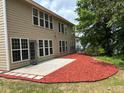 Backyard patio and manicured landscaping at 5669 Avonley Creek Dr, Sugar Hill, GA 30518
