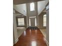 Inviting foyer with hardwood floors, high ceilings, and plenty of natural light at 5669 Avonley Creek Dr, Sugar Hill, GA 30518