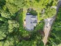 A high-angle aerial perspective of a home displaying its roof and the surrounding landscape at 2958 Paul Harris Rd, Dallas, GA 30157