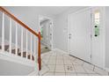 Inviting entryway with decorative tile flooring and staircase, providing a warm welcome at 2958 Paul Harris Rd, Dallas, GA 30157