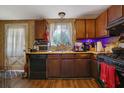Functional kitchen featuring ample cabinet space, essential appliances, and a practical layout for everyday cooking at 1377 Tucker Woods Dr, Norcross, GA 30093