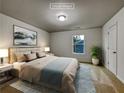 Cozy staged bedroom featuring a queen-sized bed and ample natural light at 2138 Chadwick Sw Rd, Atlanta, GA 30331