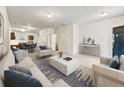 Bright, staged living room with plush furniture and an open floor plan at 2138 Chadwick Sw Rd, Atlanta, GA 30331