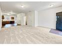 Spacious open-concept living area with new carpet and hardwood-style floors at 2138 Chadwick Sw Rd, Atlanta, GA 30331