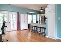 Spacious kitchen with bar seating and stainless appliances near French doors and a large bay window at 4336 Thorngate Ln, Acworth, GA 30101