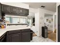 Open-concept living space featuring updated kitchen counters and open flow to a cozy living room at 1523 Dillard Rd, Stone Mountain, GA 30088