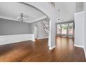 Bright, spacious living room features gleaming hardwood floors at 320 Roland Manor Dr, Dacula, GA 30019
