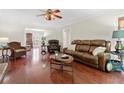 Spacious living room featuring hardwood floors, ample seating, and large windows at 3765 Peachbluff Ct, Duluth, GA 30097