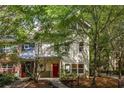 Charming two-story home with well-maintained lawn and mature trees offering shade at 1001 Dancing Fox Rd, Decatur, GA 30032