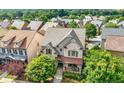 Lovely home features manicured lawn, inviting front porch, and stylish design elements at 1741 Hickory Path Way, Suwanee, GA 30024