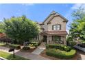 Charming two-story home with a beautifully landscaped front yard and inviting front porch at 1741 Hickory Path Way, Suwanee, GA 30024