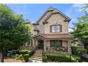 Charming two-story home with a beautifully landscaped front yard and inviting front porch at 1741 Hickory Path Way, Suwanee, GA 30024