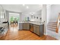 Bright kitchen featuring granite countertops, stainless steel appliances, and hardwood floors at 1286 Creekside Se Ter, Smyrna, GA 30082