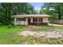 Front of single-story house with a covered porch, surrounded by a big front yard at 20 Cheryl Ter, Covington, GA 30016