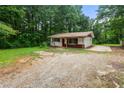 Charming single-story home featuring a cozy front yard and ample parking space at 20 Cheryl Ter, Covington, GA 30016