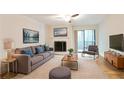 Comfortable living room with neutral decor, fireplace, balcony access, and a relaxing atmosphere at 408 River Run Dr, Sandy Springs, GA 30350