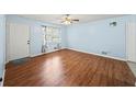 The living room features beautiful wood-look floors, and lots of natural light at 6516 Maddox Rd, Morrow, GA 30260