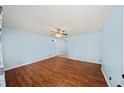 This light-filled living room features wood-look floors, and a ceiling fan at 6516 Maddox Rd, Morrow, GA 30260