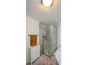 This bathroom features a glass shower and large soaking tub surrounded by beautiful marble and tile at 1315 Mcgill Park Ne Ave, Atlanta, GA 30312